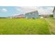 Spacious backyard with lush green grass and a play set at 4712 Clairmont Dr, Columbus, IN 47203