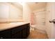 Well-lit bathroom with a vanity, large mirror, and a shower-tub combination at 4712 Clairmont Dr, Columbus, IN 47203