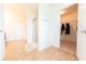 Bathroom with shower, tile flooring, and easy access to the walk-in closet at 4712 Clairmont Dr, Columbus, IN 47203