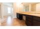 Bathroom featuring double sinks, ample countertop space and tile flooring at 4712 Clairmont Dr, Columbus, IN 47203