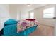 Cozy bedroom with a comfortable bed, carpet flooring and natural light at 4712 Clairmont Dr, Columbus, IN 47203
