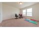 Bedroom space featuring carpet, a large window, a chair and a drumset at 4712 Clairmont Dr, Columbus, IN 47203