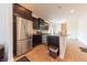 Modern kitchen with stainless steel appliances and dark wood cabinetry at 4712 Clairmont Dr, Columbus, IN 47203