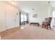 Cozy living room featuring carpeted floors and a welcoming entrance at 4712 Clairmont Dr, Columbus, IN 47203