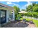 Cozy backyard patio with an umbrella, fire pit, seating, and access to the home at 4824 Eagles Watch Ln, Indianapolis, IN 46254