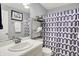 Neat bathroom featuring a vanity, mirror, and patterned shower curtain at 4824 Eagles Watch Ln, Indianapolis, IN 46254
