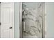 Bathroom featuring a glass-enclosed shower with marble detailing at 4824 Eagles Watch Ln, Indianapolis, IN 46254
