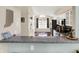 Modern kitchen featuring a breakfast bar and view into the living room at 4824 Eagles Watch Ln, Indianapolis, IN 46254