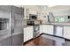 Updated kitchen with stainless steel appliances and modern fixtures at 4824 Eagles Watch Ln, Indianapolis, IN 46254
