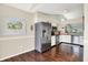 Well-lit kitchen featuring stainless steel appliances and white cabinetry at 4824 Eagles Watch Ln, Indianapolis, IN 46254