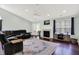 Spacious living room with vaulted ceilings, fireplace, and plenty of natural light at 4824 Eagles Watch Ln, Indianapolis, IN 46254