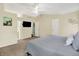 Large main bedroom with a ceiling fan and views into the bathroom at 4824 Eagles Watch Ln, Indianapolis, IN 46254