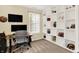 Well-lit office with dual monitors, a spacious desk, and custom built-in shelving at 4824 Eagles Watch Ln, Indianapolis, IN 46254