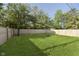 A lush green backyard with a new wood fence, perfect for outdoor activities and privacy at 4967 Diana Dr, Indianapolis, IN 46203