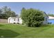 Spacious backyard with lush green lawn and mature landscaping, perfect for outdoor activities and relaxation at 4967 Diana Dr, Indianapolis, IN 46203
