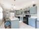 Modern kitchen featuring sleek countertops, stainless steel appliances, and stylish blue cabinets at 4967 Diana Dr, Indianapolis, IN 46203