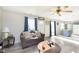 Inviting living room featuring wood floors, comfortable seating, and natural light at 4967 Diana Dr, Indianapolis, IN 46203