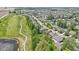 An aerial view showing the home's location within the neighborhood with walking paths, golf course and water feature at 5145 Greenside Dr, Indianapolis, IN 46235
