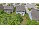 An aerial view of the home and its well-maintained backyard featuring a patio dining area at 5145 Greenside Dr, Indianapolis, IN 46235