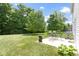A charming backyard with a patio dining set and beautiful landscaping, perfect for relaxation at 5145 Greenside Dr, Indianapolis, IN 46235