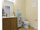 Functional bathroom with a vanity, toilet, and storage shelves, offering practicality and style at 5145 Greenside Dr, Indianapolis, IN 46235