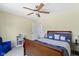 Cozy bedroom with a reading chair and warm light offers a relaxing escape at 5145 Greenside Dr, Indianapolis, IN 46235