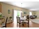 Inviting dining area featuring wood floors, natural light, and backyard access at 5145 Greenside Dr, Indianapolis, IN 46235