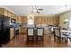 Open kitchen with wooden cabinets, a breakfast bar, and stainless steel appliances at 5145 Greenside Dr, Indianapolis, IN 46235