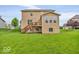 This home features a large backyard with a small patio at 532 Amersham Ct, Avon, IN 46123