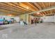 Unfinished basement with exposed wood ceiling, concrete floor, wrapped walls and some storage at 532 Amersham Ct, Avon, IN 46123