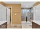 Bathroom featuring a walk-in shower with a glass door and double doors to an adjacent room at 532 Amersham Ct, Avon, IN 46123