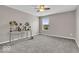 Bedroom with neutral carpeting, gray paint, and a single window at 532 Amersham Ct, Avon, IN 46123
