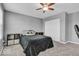 Bedroom with neutral carpeting, gray paint, and a ceiling fan at 532 Amersham Ct, Avon, IN 46123