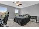 Bedroom with neutral carpeting, gray paint, a ceiling fan, and two windows at 532 Amersham Ct, Avon, IN 46123