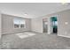 Carpeted bedroom offering a large window, neutral paint, and access to connecting rooms at 532 Amersham Ct, Avon, IN 46123