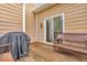 Cozy deck with wicker furniture and a covered grill, ideal for outdoor dining and relaxation at 532 Amersham Ct, Avon, IN 46123