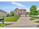 Inviting two-story home featuring a manicured lawn, neutral colors, and an attached two-car garage at 532 Amersham Ct, Avon, IN 46123