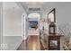 Welcoming foyer with hardwood floors, decorative console table, and view of the living spaces at 532 Amersham Ct, Avon, IN 46123