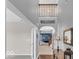 Two-story foyer featuring hardwood floors, an open floor plan, and a view to the upper level at 532 Amersham Ct, Avon, IN 46123