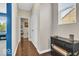 Hallway featuring hardwood floors, natural light, and access to the main living areas at 532 Amersham Ct, Avon, IN 46123