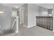 Upstairs hallway featuring neutral paint, plush carpeting, and decorative light fixtures at 532 Amersham Ct, Avon, IN 46123