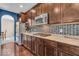 Contemporary kitchen with granite countertops, stainless appliances, and backsplash at 532 Amersham Ct, Avon, IN 46123