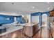 Spacious living room showcasing hardwood floors, open layout, and access to the kitchen at 532 Amersham Ct, Avon, IN 46123