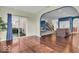 Open-concept living area with hardwood floors, natural light, and easy access to the dining room at 532 Amersham Ct, Avon, IN 46123