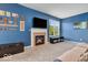 Inviting living room with a fireplace, TV, and natural light at 532 Amersham Ct, Avon, IN 46123