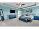 Large main bedroom featuring a ceiling fan, neutral carpeting, and soothing paint at 532 Amersham Ct, Avon, IN 46123