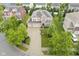Aerial view of a well-maintained home featuring a three-car garage and driveway with a basketball hoop at 548 Gosford Ct, Westfield, IN 46074