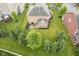 Backyard aerial showcasing the deck area and mature landscaping of a home in a residential neighborhood at 548 Gosford Ct, Westfield, IN 46074