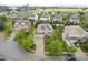 Aerial view of a home nestled in a residential neighborhood with mature trees and landscaping at 548 Gosford Ct, Westfield, IN 46074