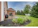 Serene backyard with patio, outdoor dining area, and well-maintained landscaping at 548 Gosford Ct, Westfield, IN 46074